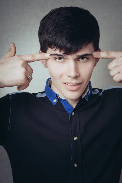 Man Shows His Index Fingers His Temples Gesture Gray Background — Stock Photo, Image