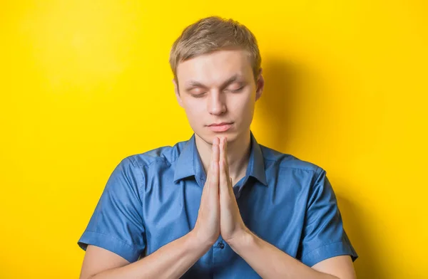 Portrait Handsome Young Man Praying Thinking Isolated Yelllow — Stock Photo, Image