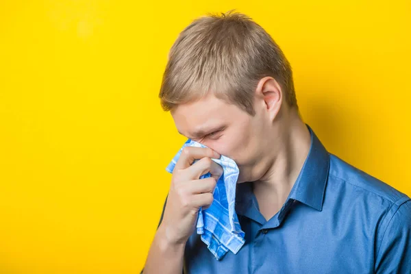 Young Man Close Blue Shirt Yellow Background Cold Cold Blowing — Stock Photo, Image