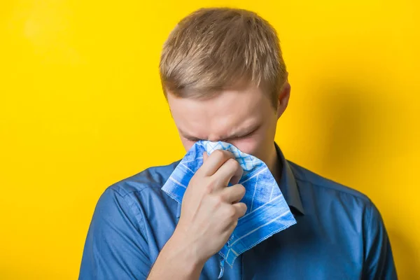 Young Man Close Blue Shirt Yellow Background Cold Cold Blowing — Stock Photo, Image