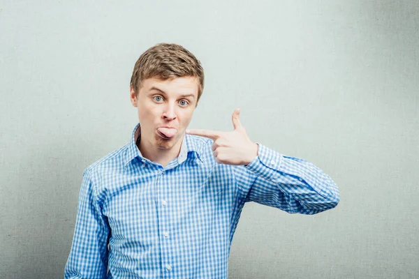 Young Man Shows His Index Finger Your Tongue — Stock Photo, Image