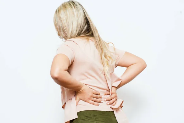 Mujer Con Dolor Espalda Contra Fondo Estudio —  Fotos de Stock