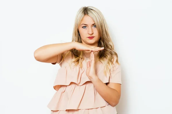 Girl making time out gesture