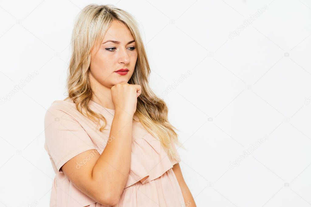 Woman thinks against studio background