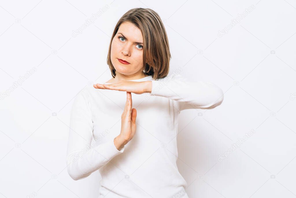 Girl making time out gesture