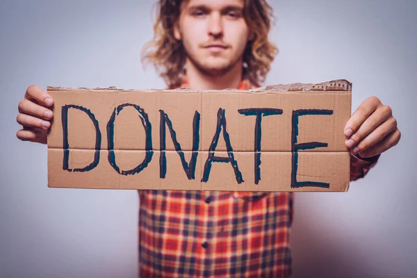 male, cardboard sign donation. On a gray background