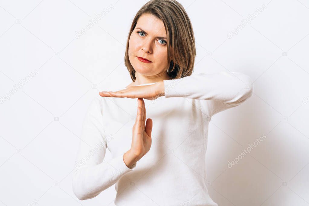 Girl making time out gesture