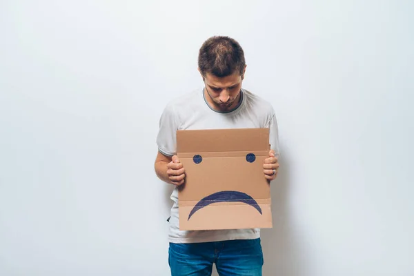 Homem Segurando Uma Foto Com Sorriso Infeliz — Fotografia de Stock