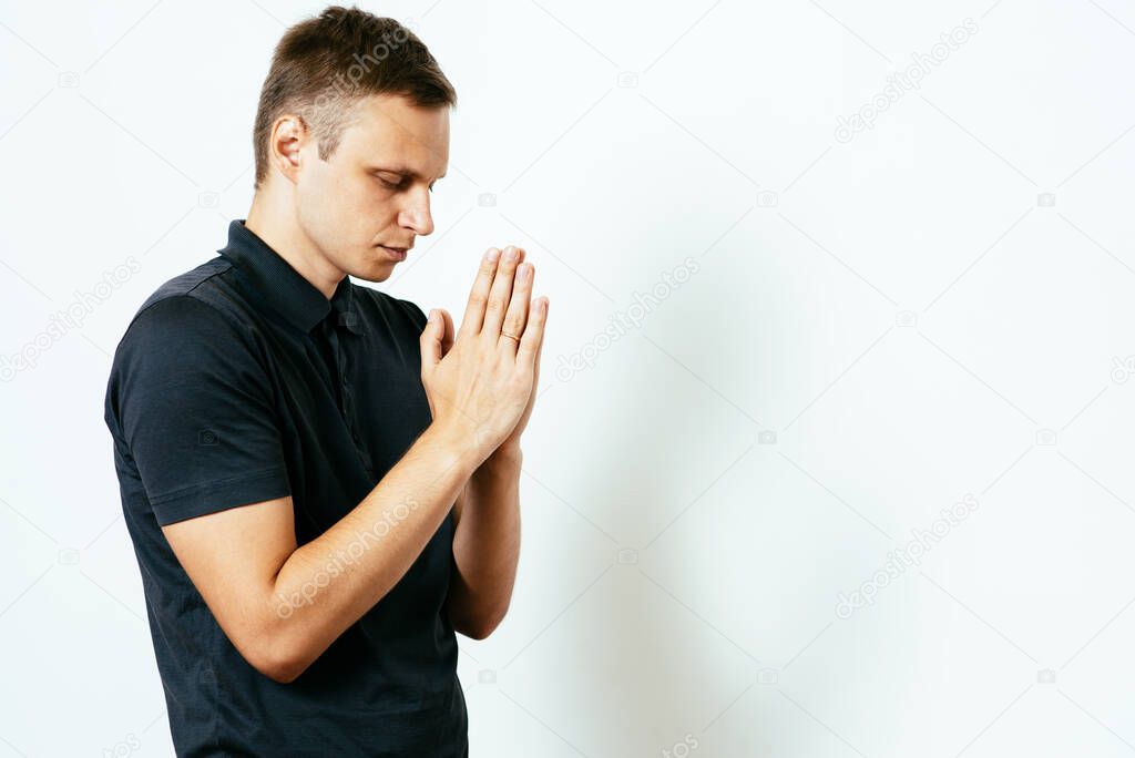 Prayer. Man. in photo studio