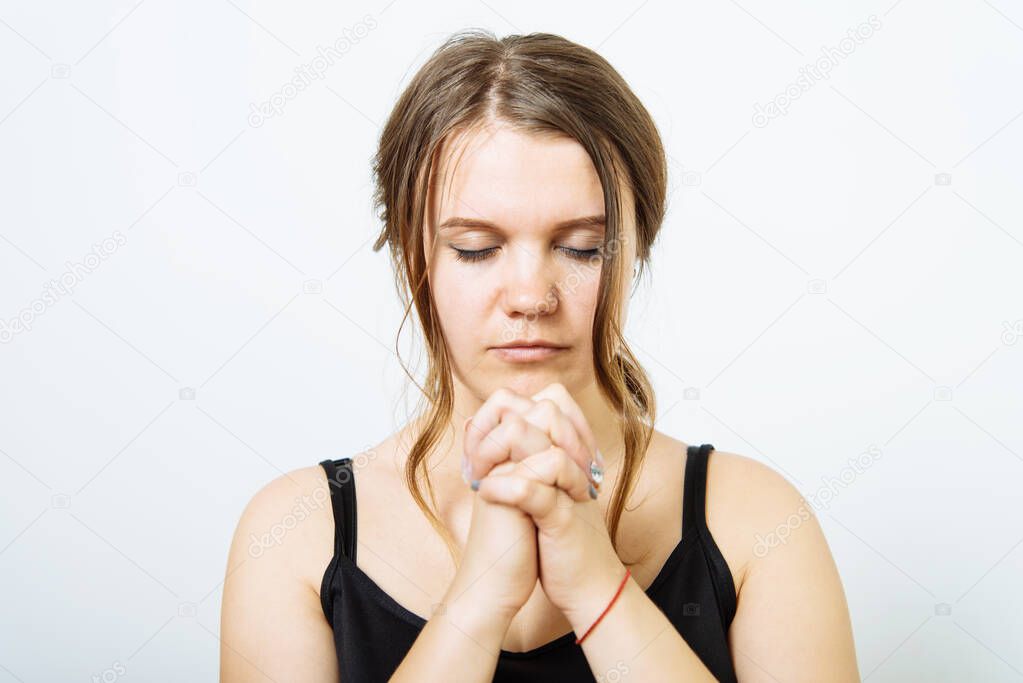 Prayer. Female. in photo studio