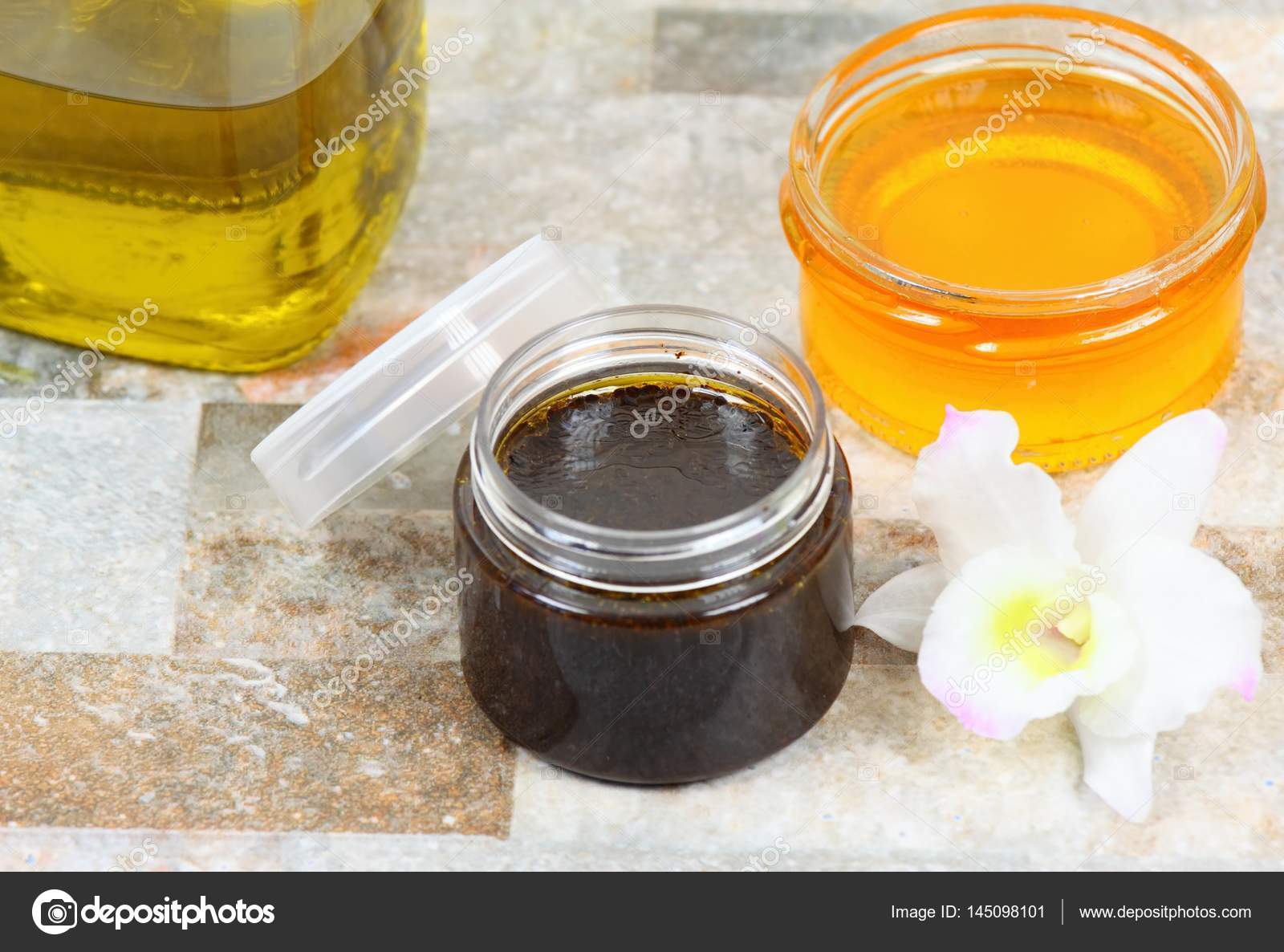 Skin scrub from used coffee grounds, honey and olive oil Stock Photo by