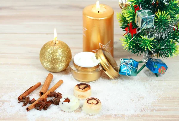 Christmas spa concept with candles and Christmas tree. Stock Image