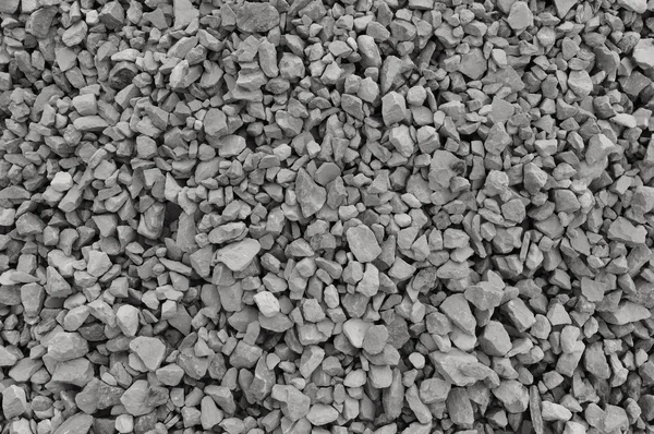 Fondo de piedra de grava gris y beige abstracto, piedras grises trituradas y textura de piezas de granito, patrón de mezcla de material de roca de construcción rugosa texturizada horizontal detallada grande — Foto de Stock