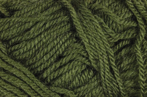 Textura de fios de lã fina verde natural, fio texturizado horizontal clew macro closeup fundo padrão — Fotografia de Stock