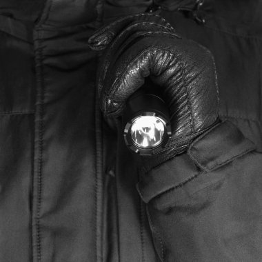Gloved Hand Holding Tactical Flashlight, Bright Light Emiting Brightly Lit, Serrated Strike Bezel, Black Grain Leather Glove And Cop Jacket, Large Detailed Vertical Closeup, Patrolling Police Security Guard Staff Policeman, Covert Operations Patrol clipart
