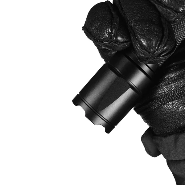 Gloved Hand Holding Tactical Flashlight, Bright Light Emiting Brightly Lit, Serrated Strike Bezel, Black Grain Leather Glove And Cop Jacket, Large Detailed Isolated Vertical Closeup, Patrolling Police Security Guard Staff Policeman, Covert Operations — Stock Photo, Image