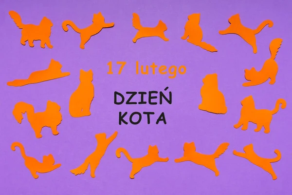 Happy Cat Day in Poland. Orange funny cat silhouettes on lilac pastel background. Festive layout for feline holiday, text in Polish 17 FEBRUARY CAT DAY. Flat lay, top view