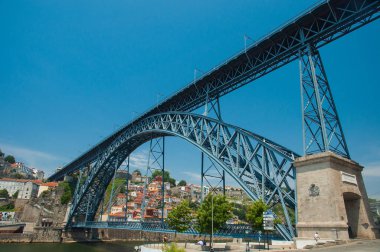PORTO, PORTUGAL - 25 JUNE, 2010: Old town cityscape on the Douro River with traditional Rabelo boats in Porto, Portugal.
