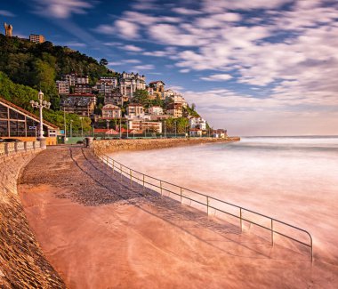 SAN SEBASTIAN, SPAIN - 7 MAY, 2019: Nice beach with houses in San Sebastian, Spain. San Sebastian