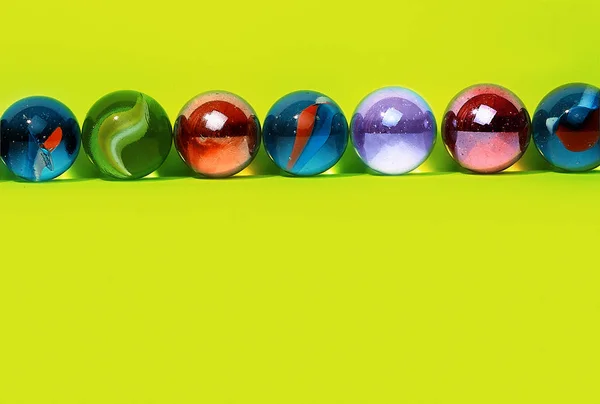 Colorful Marbles Green Background — Stock Photo, Image