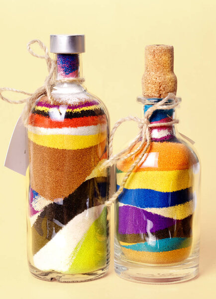 Glass bottles with colored sand. Sand art in a bottle