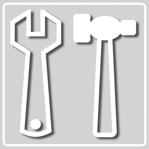 Grå ikon med vit silhuett av verktyg — Stock vektor