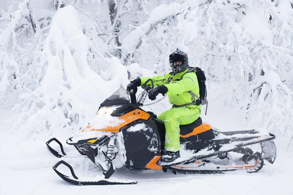 Man driving snowmobile