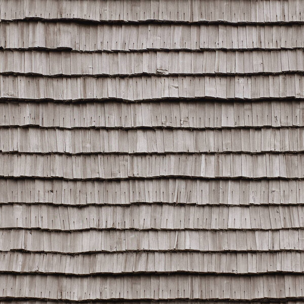 Wooden old retro style roof texture on old house, seamlessly tileable background