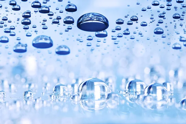 Gocce d'acqua blu sfondo astratto, prospettiva con bokeh — Foto Stock