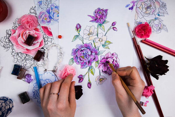 The creative table of the artist drawing sketches.