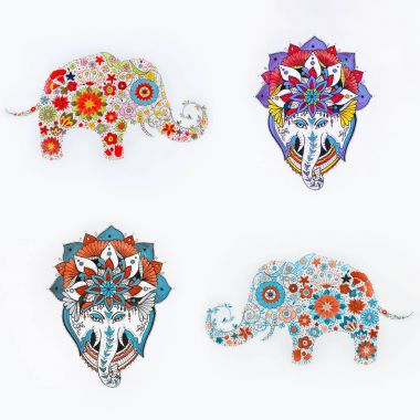 Küme fil skeçler çiçek desenleri ve beyaz bir arka plan üzerinde mandala.