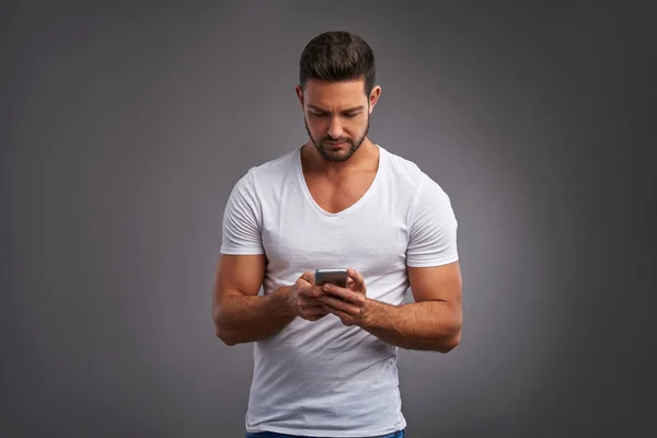 Young man with a smartphone — Stock Photo, Image