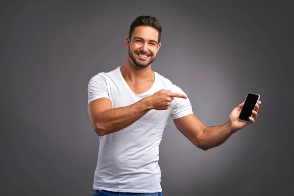 Young man with a smartphone — Stock Photo, Image