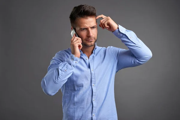 Young man with a smartphone — Stock Photo, Image