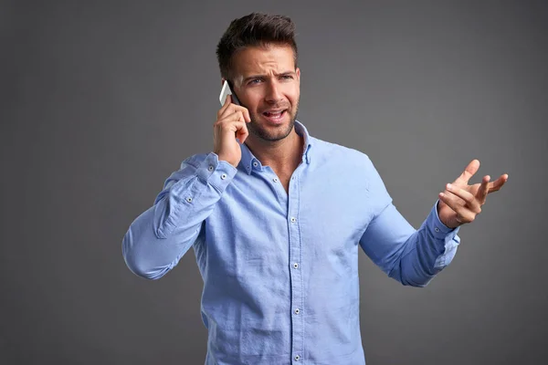 Young man with a smartphone — Stock Photo, Image