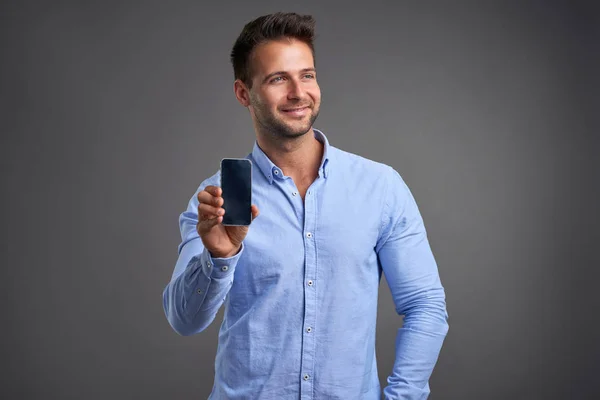 Young man with a smartphone — Stock Photo, Image