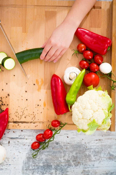 A woman's hand with vegetables — Stock Photo, Image