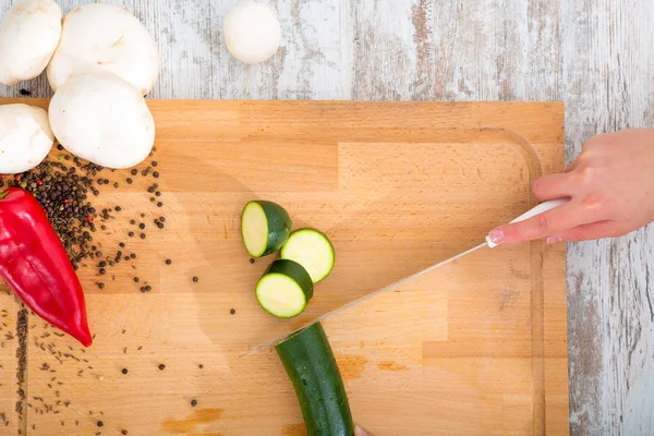 A woman's hand with vegetables — Stock Photo, Image