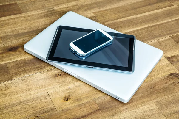 Digital devices on a wooden Desktop — Stock Photo, Image