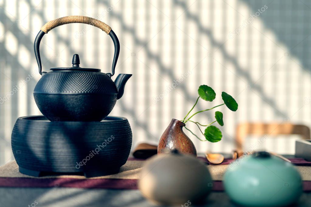 Asian tea set on wooden table