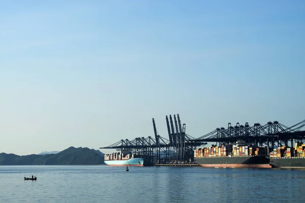 Container terminal, viewed from the water, on a clear blue day. — Stock Photo, Image