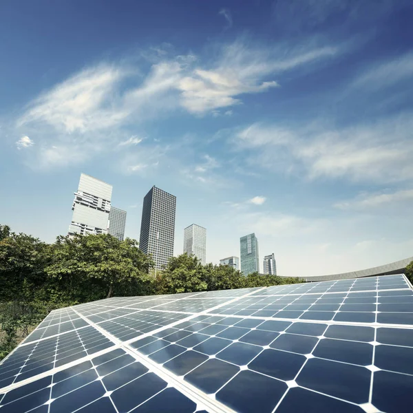 Solar panels and city — Stock Photo, Image