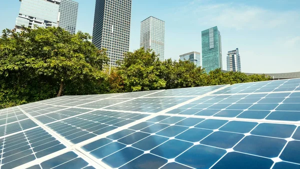 Solar panels and city — Stock Photo, Image