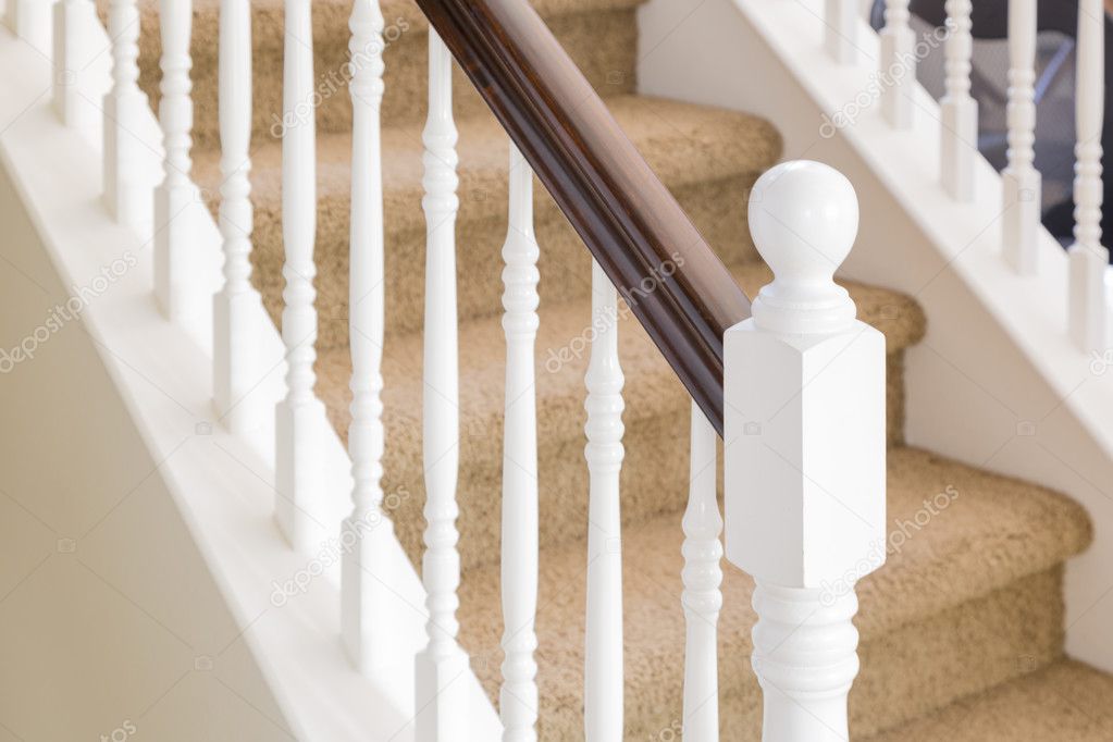 Abstract of Stair Railing and Carpeted Steps in House