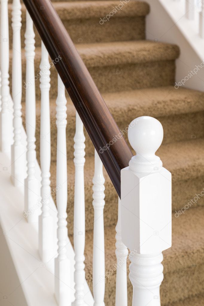 Abstract of Stair Railing and Carpeted Steps in House