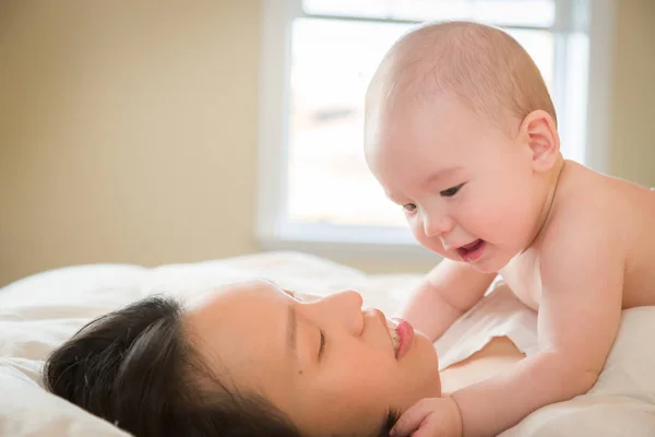 Mixed Race Chinese and Caucasian Baby Boy Laying In Bed with His — Stock Photo, Image