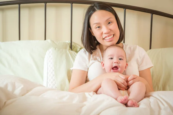 Mixed Race Chinese and Caucasian Baby Boy Laying In Bed with His — Stock Photo, Image