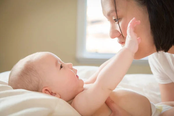 Mixed Race Chinese and Caucasian Baby Boy Laying In Bed with His — Stock Photo, Image