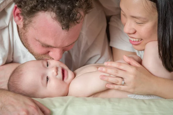 Mixed Race Chinese and Caucasian Baby Boy Laying In Bed with His — Stock Photo, Image