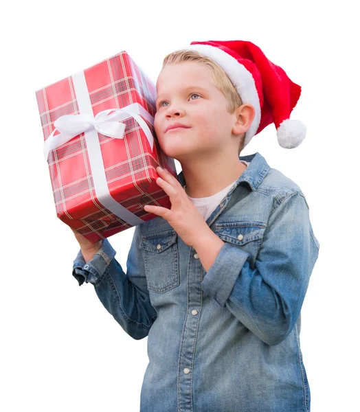 Jeune garçon portant un chapeau de Père Noël tenant un cadeau de Noël — Photo